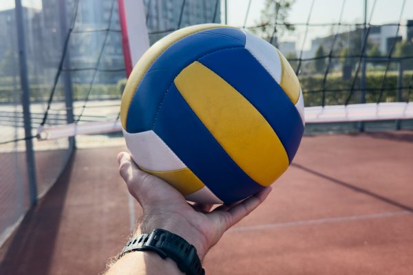 volleyball. blue with yellow color ball on the playground. volleyball cover, red. ball game. High quality photo